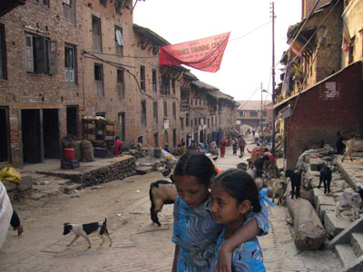 Photo 2: In Kokana. Friends, goats, and Maoist’s flag.